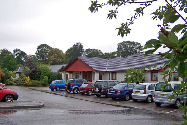A resident and team member in a resident room